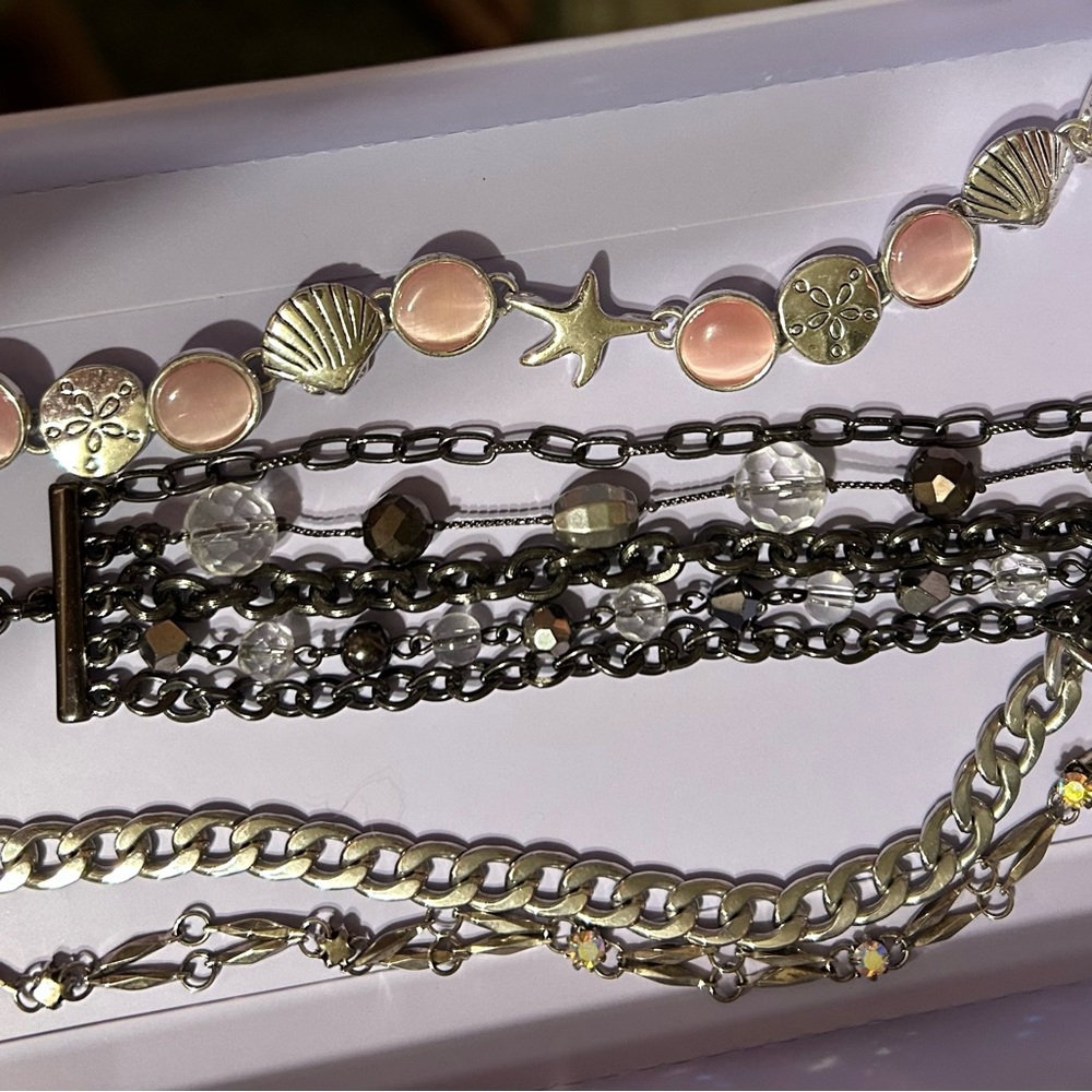 Lot of 4 bracelets, all wearable and in great condition.